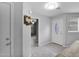 Inviting entryway featuring tile floors, a decorated front door and a hallway leading to other rooms at 12841 W W . Via Camille --, El Mirage, AZ 85335