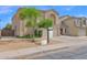 Two story home featuring a two car garage, neutral exterior paint, and desert landscaping at 12841 W W . Via Camille --, El Mirage, AZ 85335