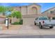 Home exterior with landscaping, large garage, and truck parked in driveway at 12841 W W . Via Camille --, El Mirage, AZ 85335