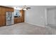 Open kitchen with stainless steel refrigerator, tile flooring and wooden cabinets at 12841 W W . Via Camille --, El Mirage, AZ 85335