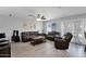 Open-concept living room featuring tile floors, ample natural light, ceiling fan, and exit to backyard at 12841 W W . Via Camille --, El Mirage, AZ 85335