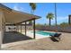 Backyard oasis with a refreshing pool, covered patio and lounge seating at 2305 E Glade Ave, Mesa, AZ 85204