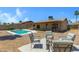 Relaxing backyard features a cozy firepit and ample seating area at 2305 E Glade Ave, Mesa, AZ 85204
