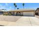 Charming single-story home with low maintenance gravel front yard and attached two car garage at 2305 E Glade Ave, Mesa, AZ 85204