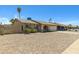 Charming single-story home with low maintenance gravel front yard and an attached two car garage at 2305 E Glade Ave, Mesa, AZ 85204