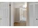 Inviting hallway with wood flooring and neutral paint leads to other rooms at 2305 E Glade Ave, Mesa, AZ 85204