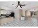 Kitchen view featuring white cabinetry, black appliances, and an open concept design to dining area at 2305 E Glade Ave, Mesa, AZ 85204