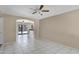 Bright, open living space with tile flooring and a seamless flow to the kitchen and outdoor pool area at 2305 E Glade Ave, Mesa, AZ 85204