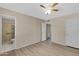 Spacious main bedroom with new flooring and an en suite bathroom at 2305 E Glade Ave, Mesa, AZ 85204