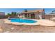 Home backyard with an above ground pool, desert landscaping, partial patio, and fencing at 2509 N Cheri Lynn Dr, Chandler, AZ 85225