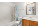 Cozy bathroom with a shower-tub combination and vanity with traditional finishes at 2509 N Cheri Lynn Dr, Chandler, AZ 85225