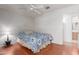 Bright bedroom features a ceiling fan and doorway to the bathroom at 2509 N Cheri Lynn Dr, Chandler, AZ 85225