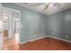 Plain bedroom with ceiling fan and wood-look floors ready for customization at 2509 N Cheri Lynn Dr, Chandler, AZ 85225