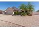 Traditional home with neutral siding, desert landscaping, a long driveway, and an attached two car garage at 2509 N Cheri Lynn Dr, Chandler, AZ 85225