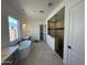 Modern bathroom featuring a soaking tub, separate shower, and double vanities with tile flooring at 26232 N 77Th Dr, Peoria, AZ 85383