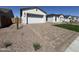 Charming single-story home featuring an attached garage and a nicely paved driveway in a well-maintained neighborhood at 26232 N 77Th Dr, Peoria, AZ 85383
