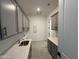 Functional laundry room featuring ample counter space and cabinets, enhancing convenience at 26232 N 77Th Dr, Peoria, AZ 85383