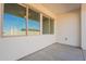 Extended back patio with a ceiling fan and views of the desert landscape at 34865 N Palm Dr, San Tan Valley, AZ 85140