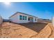 The home includes a large backyard, waiting to be landscaped or customized at 34865 N Palm Dr, San Tan Valley, AZ 85140