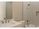 The bathroom features a shower/tub with bright white tiling and a built-in shelf at 34865 N Palm Dr, San Tan Valley, AZ 85140