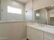 Bathroom with white cabinets, white countertop, and a glass-enclosed shower at 34865 N Palm Dr, San Tan Valley, AZ 85140