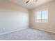 Cozy bedroom with carpet flooring and a bright window at 34865 N Palm Dr, San Tan Valley, AZ 85140