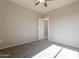 Bedroom with carpet flooring, neutral walls, and a view into the hallway at 34865 N Palm Dr, San Tan Valley, AZ 85140