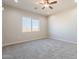 Bedroom with carpet flooring, neutral paint, a ceiling fan, and a window at 34865 N Palm Dr, San Tan Valley, AZ 85140