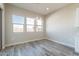 The dining area is well-lit from its chandelier and several windows at 34865 N Palm Dr, San Tan Valley, AZ 85140