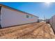 Back exterior of house has a blank canvas ready for landscaping or a pool at 34865 N Palm Dr, San Tan Valley, AZ 85140