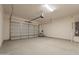 An attached two-car garage features a roll-up door and utility hookups at 34865 N Palm Dr, San Tan Valley, AZ 85140