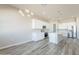 This open kitchen features a central island, stainless appliances, and ample storage and counter space at 34865 N Palm Dr, San Tan Valley, AZ 85140