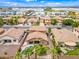 A panoramic aerial view showcasing the home's pool and landscaping amidst a neighborhood of similar properties at 3671 E Kingbird Pl, Chandler, AZ 85286