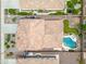 A top-down shot reveals a house with a private pool and patio, beautifully integrated into a well-maintained backyard at 3671 E Kingbird Pl, Chandler, AZ 85286