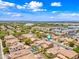 Aerial view of the home with a pool, showing its proximity to commercial areas and community amenities at 3671 E Kingbird Pl, Chandler, AZ 85286