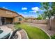 A well maintained backyard with lush green grass, a pool and a covered patio at 3671 E Kingbird Pl, Chandler, AZ 85286