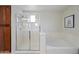 Stylish bathroom showcases a glass enclosed shower and separate tub for the ultimate relaxation at 3671 E Kingbird Pl, Chandler, AZ 85286