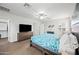 Bright main bedroom features neutral carpet, ceiling fan, and stylish decor for a comfortable retreat at 3671 E Kingbird Pl, Chandler, AZ 85286