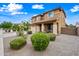 Two-story home with well-manicured landscaping and desert rock at 3671 E Kingbird Pl, Chandler, AZ 85286