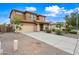 Charming two-story home with a well-manicured lawn, a neutral color scheme, and a spacious two-car garage at 3671 E Kingbird Pl, Chandler, AZ 85286
