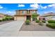 Beautiful two-story home with a well-manicured front yard and a spacious driveway at 3671 E Kingbird Pl, Chandler, AZ 85286