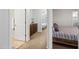 Hallway showcasing a connecting bedroom and bathroom, with light brown cabinets along the wall at 3671 E Kingbird Pl, Chandler, AZ 85286