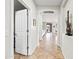 Bright hallway with tile floors and arched doorways, showcasing a spacious layout at 3671 E Kingbird Pl, Chandler, AZ 85286