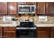 Updated kitchen with stainless steel microwave and range at 3671 E Kingbird Pl, Chandler, AZ 85286