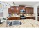 Close up of granite counters, stainless steel appliances and custom cabinets in kitchen at 3671 E Kingbird Pl, Chandler, AZ 85286