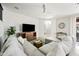 Cozy living room with a comfortable sectional sofa, perfect for relaxation and entertainment at 3671 E Kingbird Pl, Chandler, AZ 85286