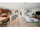 Expansive open-concept living area with kitchen, dining, and staircase boasting tons of natural light at 3671 E Kingbird Pl, Chandler, AZ 85286