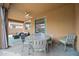Inviting covered patio featuring a ceiling fan and outdoor seating area perfect for entertaining at 3671 E Kingbird Pl, Chandler, AZ 85286