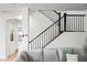 Stylish staircase with black iron railing and views of the living space at 3671 E Kingbird Pl, Chandler, AZ 85286