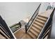 Stylish staircase with black iron railing and comfortable carpet, joining two floors at 3671 E Kingbird Pl, Chandler, AZ 85286